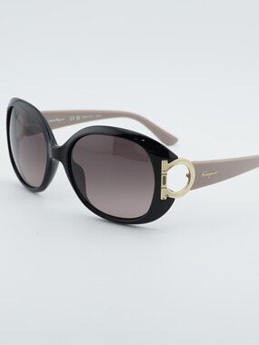 Salvatore Ferragamo SF668S 001 Sunglasses Black Round Frame, Brown Lenses
